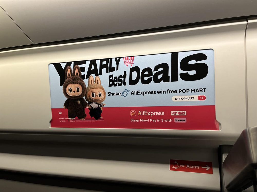 AliExpress transit ad inside London train